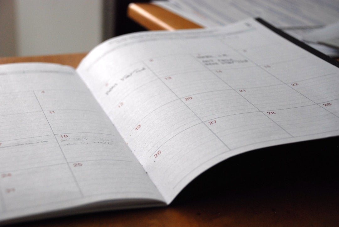 Monthly schedule and planning notebook on a desk