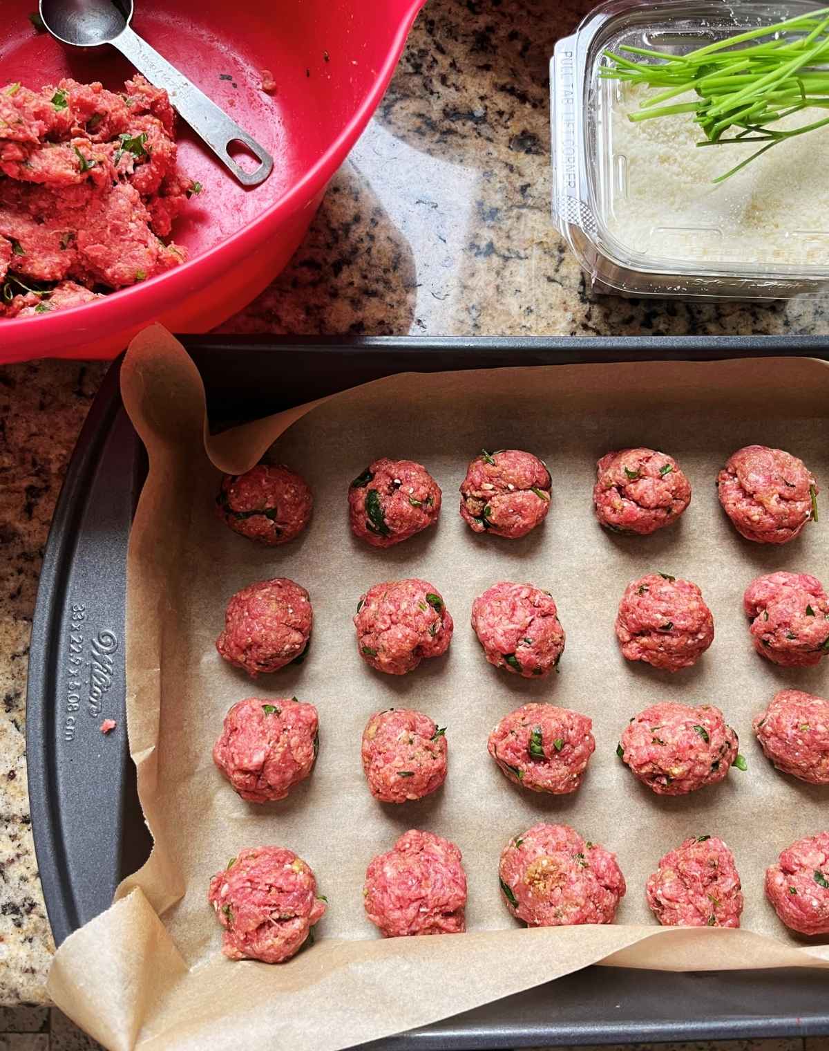 Uncooked bison meatballs on a tray