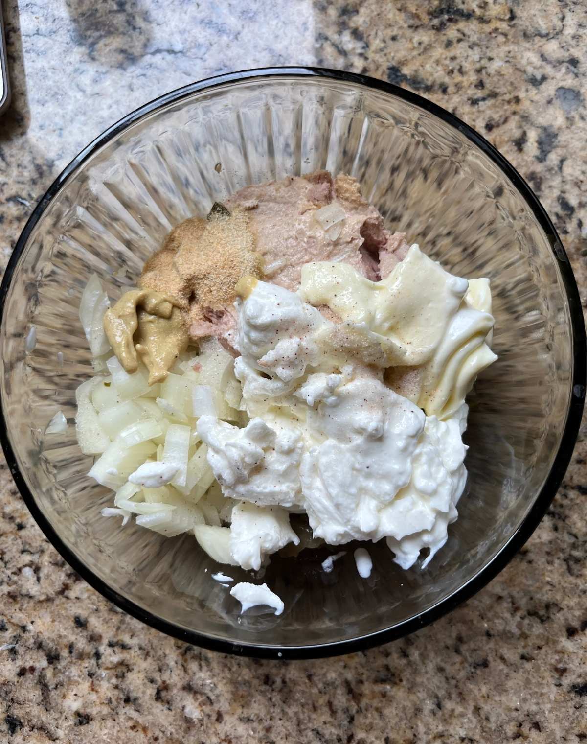 Tuna salad ingredients in a bowl