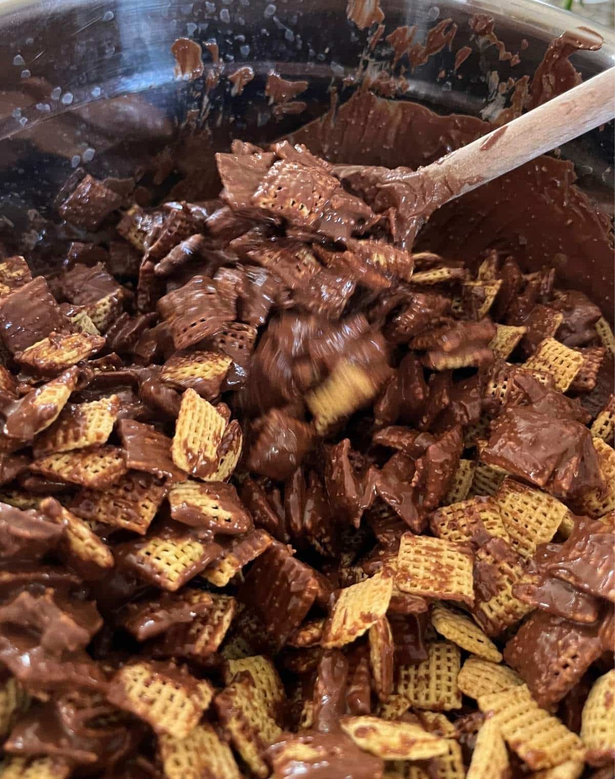 Chex getting covered with chocolate