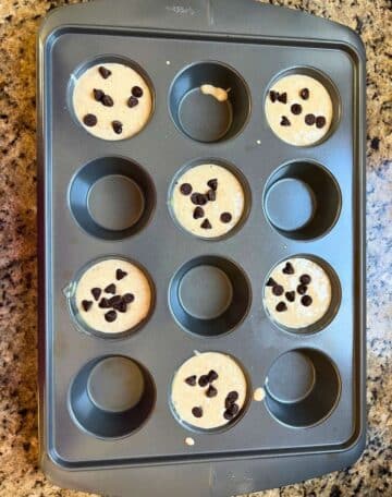 uncooked muffins in tin