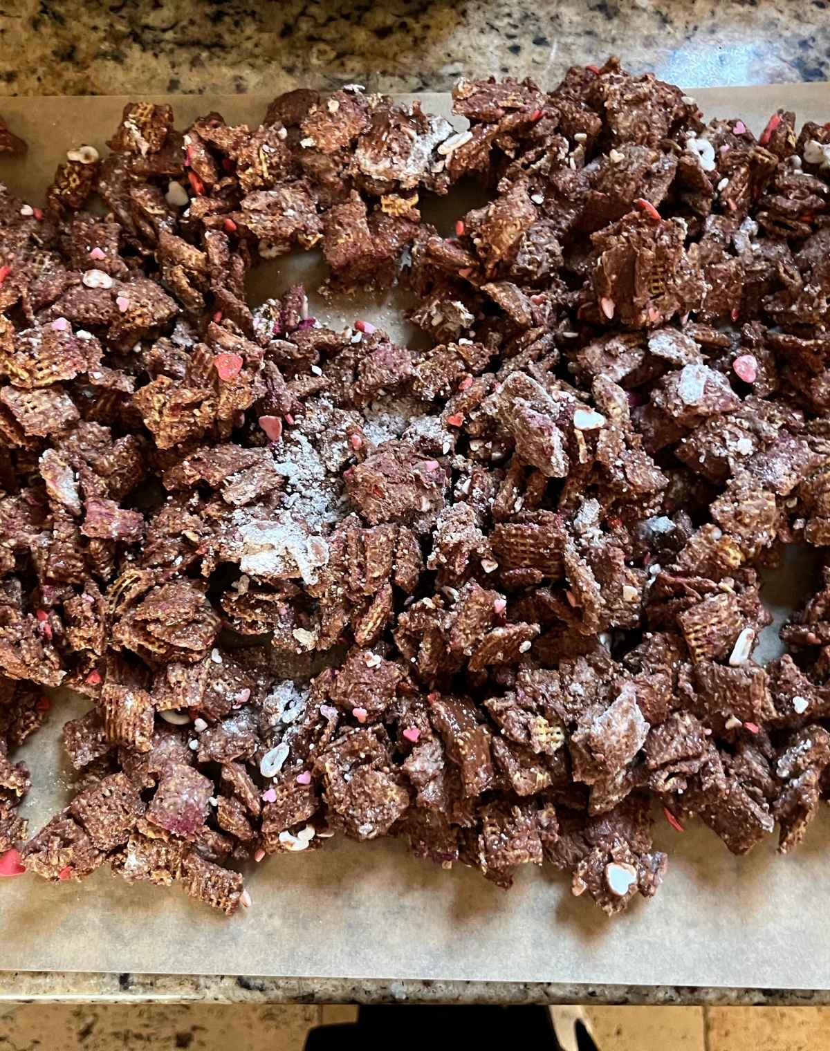 Valentine's Puppy Chow on Parchment Paper