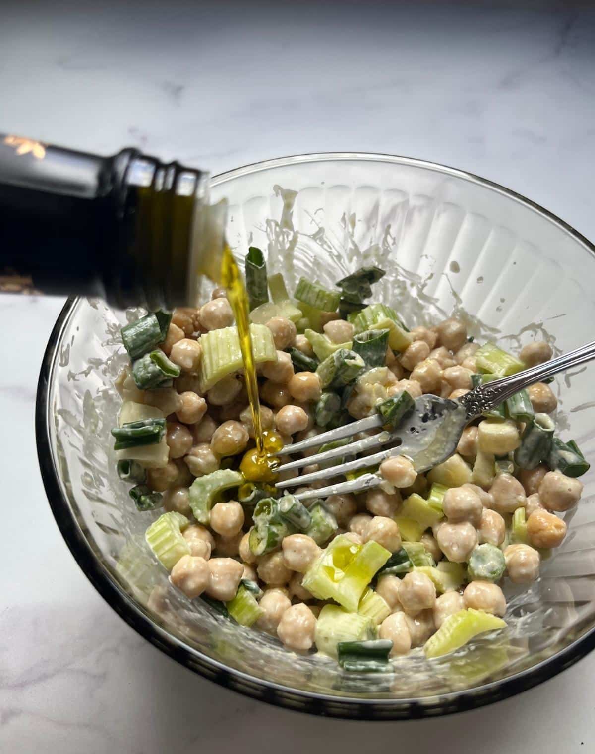 Pouring some olive oil into the bowl